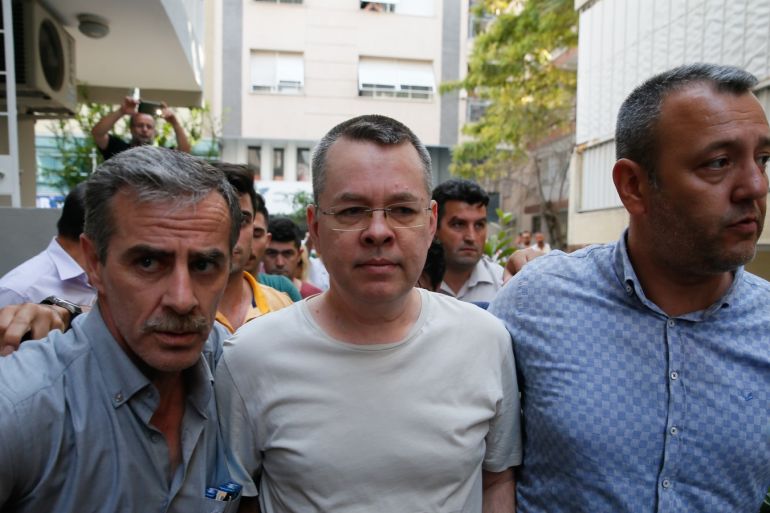 Turkey places jailed US cleric under house arrest- - IZMIR, TURKEY - JULY 25: American Pastor Andrew Craig Brunson (C), who was charged with committing crimes, including spying for the PKK terror group and the Fetullah Terrorist Organization, arrives at the address, which he was put under house arrest due to his health problems, in Izmir, Turkey on July 25, 2018.