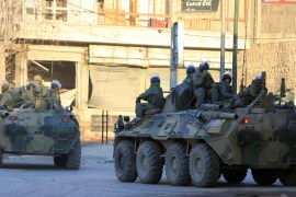 Russian soldiers, on armoured vehicles, patrol a street in Aleppo, Syria February 2, 2017. REUTERS/Ali Hashisho