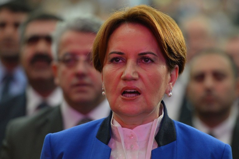 ANKARA, TURKEY - OCTOBER 25: Turkey's former interior minister and deputy parliament speaker Meral Aksener, sings the national anthem during a meeting to announce her new center right opposition party on October 25, 2017 in Ankara, Turkey. Aksener has named her party 'Iyi Parti' and their motto is 'Turkey Will Be Good.' (Photo by Mustafa Kirazli/Getty Images)