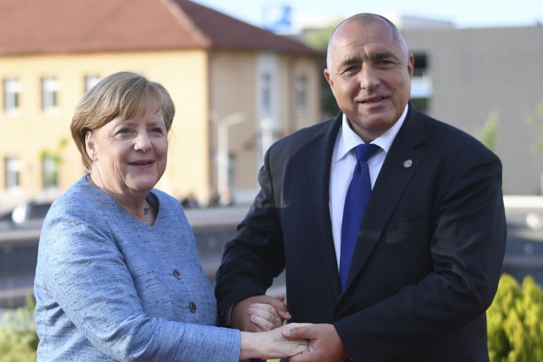 German Chancellor Angela Merkel is welcomed by Bulgaria's Prime Minister Boyko Borisov before an informal dinner ahead of a summit with leaders of the six Western Balkans countries in Sofia, Bulgaria, May 16, 2018. Vassil Donev/Pool via REUTERS