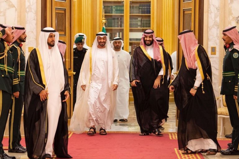 Abu Dhabi Crown Prince Sheikh Mohammed bin Zayed walks with Saudi Crown Prince Mohammed bin Salman