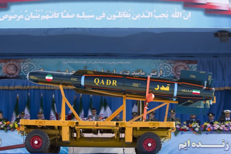 Reuters and other foreign media are subject to Iranian restrictions on leaving the office to report, film or take pictures in Tehran.Iranian President Mahmoud Ahmadinejad and military commanders (in background) watch as a Qadr missile passes by during the Army Day military parade in Tehran