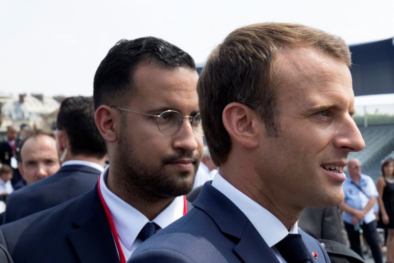 French President Emmanuel Macron walks ahead of his aide Alexandre Benalla at the end of the Bastille Day military parade in Paris, France, July 14, 2018. Picture taken July 14, 2018. REUTERS/Philippe Wojazer/Pool
