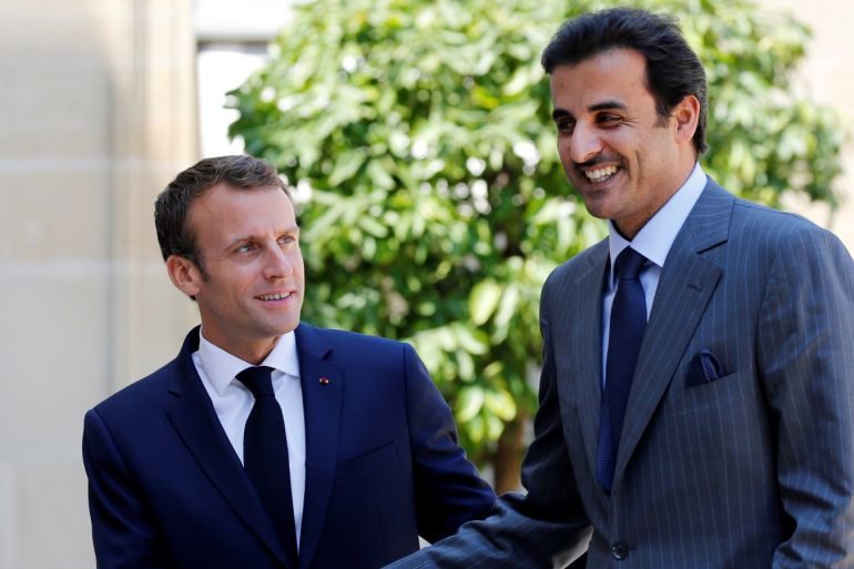 French President Emmanuel Macron welcomes Qatari Emir Sheikh Tamim bin Hamad al-Thani as he arrives at the Elysee Palace in Paris, France, July 6, 2018. REUTERS/Regis Duvignau