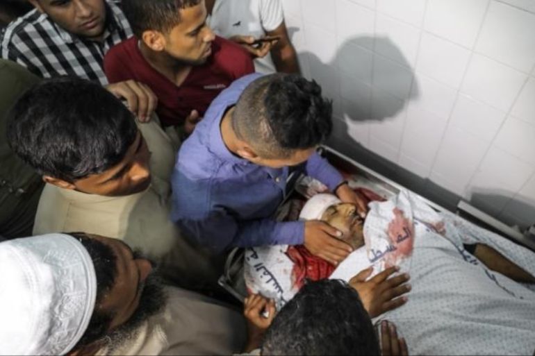 Two martyrs in Gaza, one child with a group "our children martyrs"