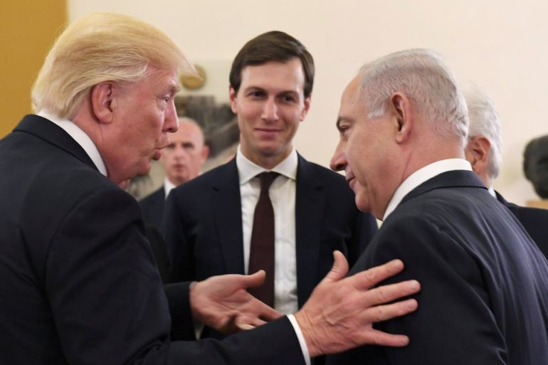 Israel Prime Minister Benjamin Netanyahu and President Donald Trump chat as White House senior advisor Jared Kushner is seen in between them