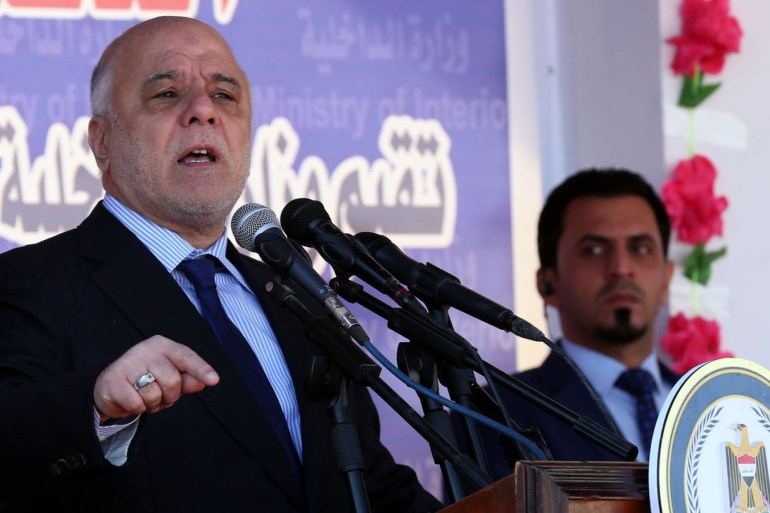 epa06426783 Iraqi Prime Minster Haider al-Abadi speaks during a celebration on the occasion of the 96th Police Day at the police academy in Baghdad, Iraq, 09 January 2018. EPA-EFE/ALI ABBAS