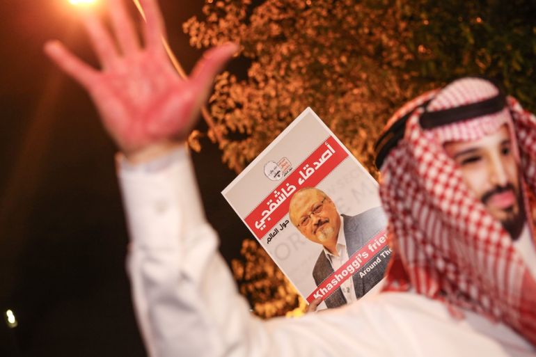Killing of Saudi journalist Jamal Khashoggi- - ISTANBUL, TURKEY - OCTOBER 25: A man, coloured his hands red, attends a demonstration, organised on the killing of Saudi journalist Jamal Khashoggi, with the mask of Crown Prince of Saudi Arabia Mohammad bin Salman in front of the Saudi Consulate in Istanbul, Turkey on October 25, 2018.