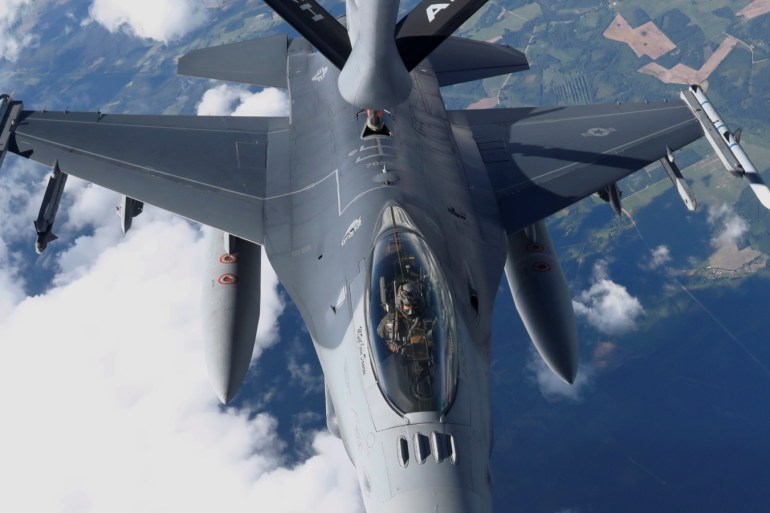 A U.S. Air Force KC-135 aerial refueling aircraft refuels an F-16 fighter during the U.S.-led Saber Strike exercise in the air over Estonia June 6, 2018. REUTERS/Ints Kalnins