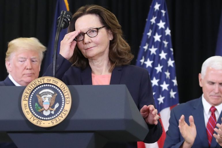 LANGLEY, VA - MAY 21: Gina Haspel prepares to speak while flanked by U.S. President Donald Trump (L) and Vice President Mike Pence, after she was sworn in as CIA director during a swearing-in ceremony at agency headquarters, May 21, 2018 in Langley, Virginia. Last week the Senate confirmed Haspel to replaced Mike Pompeo who was sworn in as Secretary of State earlier this month. Mark Wilson/Getty Images/AFP== FOR NEWSPAPERS, INTERNET, TELCOS & TELEVISION USE ONLY ==