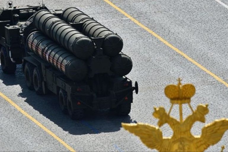 Russian S-400 Triumph/SA-21 Growler medium-range and long-range surface-to-air missile systems drive during a parade at Red Square in Moscow in 2015