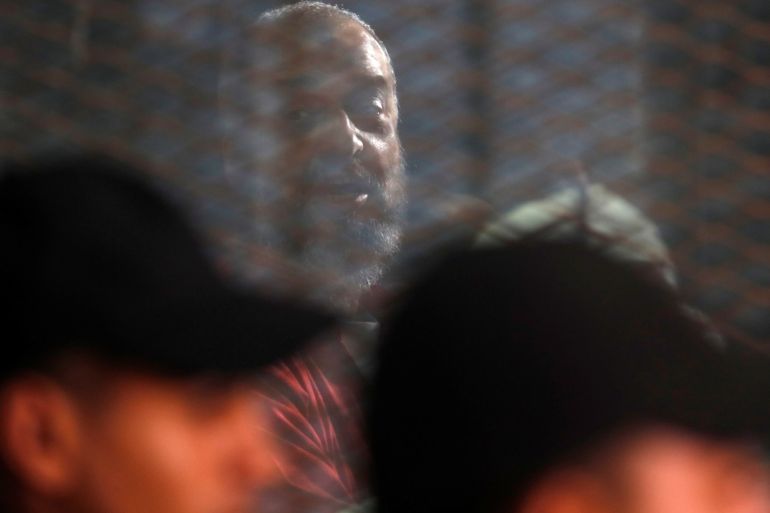 Muslim Brotherhood's senior member Mohamed El-Beltagy is seen behind bars during a court case accusing ousted Islamist president Mohamed Mursi of breaking out of prison in 2011, in Cairo, Egypt, December 26, 2018. REUTERS/Amr Abdallah Dalsh