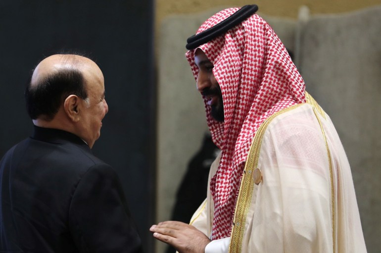 Saudi Arabia's Crown Prince Mohammed bin Salman talks with Yemen's President Abd-Rabbu Mansour Hadi, ahead of the 29th Arab Summit in Dhahran, Saudi Arabia April 15, 2018. REUTERS/Hamad I Mohammed