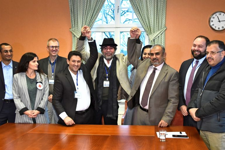 At left, Abdelqader al-Murtada and Saelem Mohammed Noman Al-Mughalles, representatives of the Ansar Allah delegation and at right, Askar Zaeil and Hadi al-Hayi representing the delegation of the Government of Yemen gesture at the negotiating table together with representatives from the office of the U.N. Special Envoy for Yemen and the International Red Cross Committee (ICRC) after lists of prisoners were exchanged, a first step to implement the agreement to release all