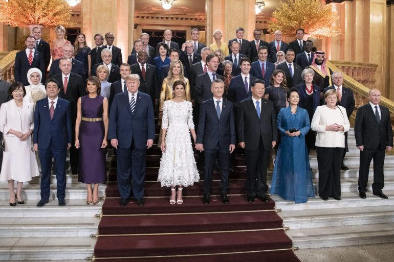 BUENOS AIRES, ARGENTINA - NOVEMBER 30: In this handout photo provided by the German Government Press Office (BPA), Japan's Prime Minister Shinzo Abe and his wife Akie, US President Donald Trump with his wife Melania, Argentina's President Mauricio Macri with his wife Juliana Awada, China's President Xi Jinping with his with wife Peng Liyuan, Germany's Chancellor Angela Merkel, and Russia's President Vladimir Putin (L-R 1st row), India's Prime Minister Narendra Mo