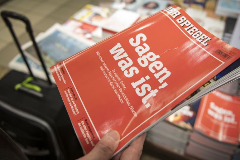 COLOGNE, GERMANY - DECEMBER 22: A man holts the latest issue of German newsweekly Der Spiegel with a cover page that reads: 'To say, what is' at a kiosk on December 22, 2018 in Cologne, Germany. The quote refers to the credo of Rudolf Augstein, founder of the magazine, in his and the magazine's commitment to honest reporting. The issue is devoted to a scandal that has rocked Der Spiegel: the recent revelation by the magazine that one of its star reporters, Claas Relo