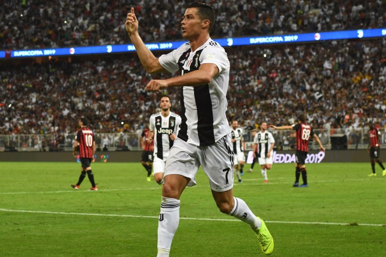 JEDDAH, SAUDI ARABIA - JANUARY 16: Cristiano Ronaldo of Juventus celebrates after scoring his sides first goal during the Italian Supercup match between Juventus and AC Milan at King Abdullah Sports City on January 16, 2019 in Jeddah, Saudi Arabia. (Photo by Claudio Villa/Getty Images for Lega Serie A)