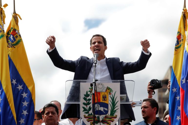 Juan Guaido, President of Venezuela's National Assembly, reacts during a rally against Venezuelan President Nicolas Maduro's government and to commemorate the 61st anniversary of the end of the dictatorship of Marcos Perez Jimenez in Caracas, Venezuela January 23, 2019. REUTERS/Carlos Garcia Rawlins