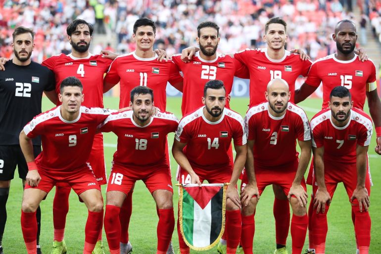 epa07286505 Players of Palestine line up for the 2019 AFC Asian Cup group B preliminary round soccer match between Palestine and Jordan in Abu Dhabi, United Arab Emirates, 15 January 2019. EPA-EFE/MAHMOUD KHALED