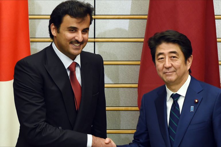 epa04628439 Qatar's Sheikh Tamim bin Hamad al-Thani (L) is greeted by Japanese Prime Minister Shinzo Abe (R) prior to their talks at Abe's official residence in Tokyo, Japan, 20 February 2015. The Qatari emir arrived on 19 February 2015 for ha two-day official working visit to Japan. EPA/TOSHIFUMI KITAMURA / POOL