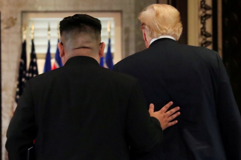 U.S. President Donald Trump and North Korea's leader Kim Jong Un leave after signing documents that acknowledge the progress of the talks and pledge to keep momentum going, after their summit at the Capella Hotel on Sentosa island in Singapore June 12, 2018. REUTERS/Jonathan Ernst TPX IMAGES OF THE DAY