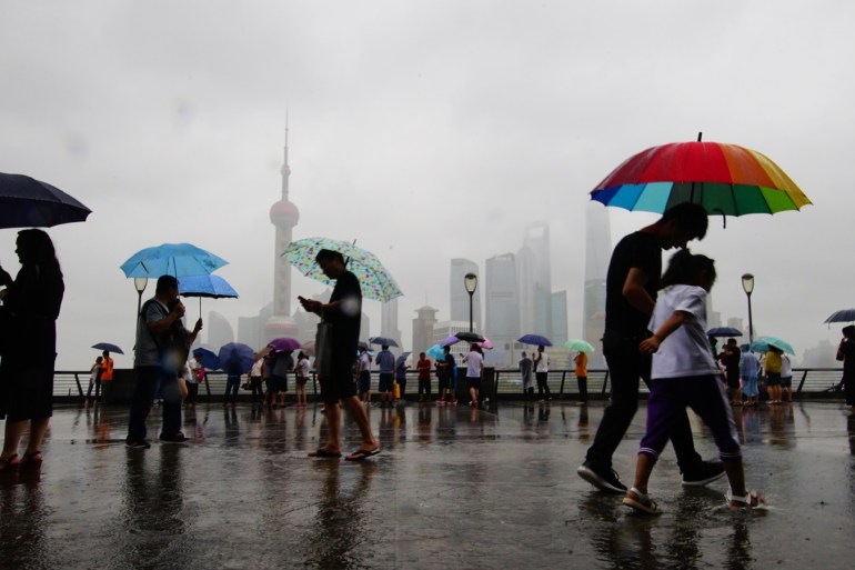 SHANGHAI, CHINA - JULY 22: People visit The Bund after typhoon Ampil landfall on July 22, 2018 in Shanghai, China. Typhoon Ampil made landfall on Chongming Island at 12:30 p.m. Sunday in Shanghai. (Photo by VCG)