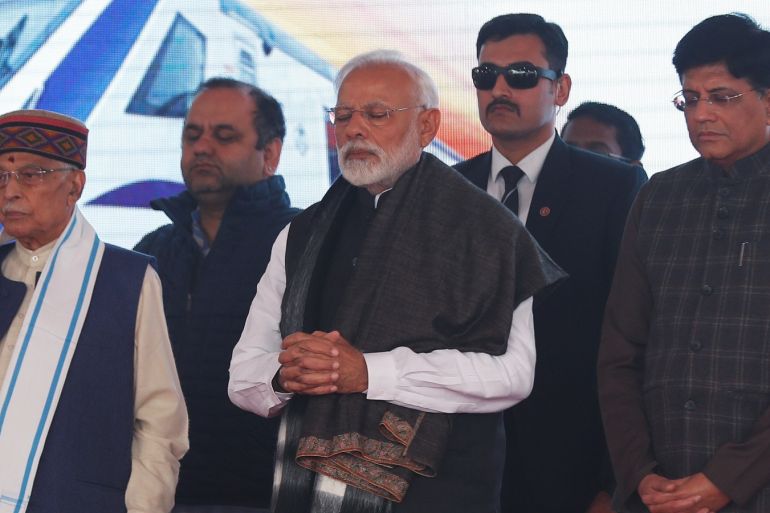 India's Prime Minister Narendra Modi observes two minutes of silence to pay tribute to Central Reserve Police Force (CRPF) personnel, who were killed after a suicide bomber rammed a car into a bus carrying them in south Kashmir on Thursday, before flagging off India's fastest train 'Vande Bharat Express' at a ceremony in New Delhi, India, February 15, 2019. REUTERS/Adnan Abidi