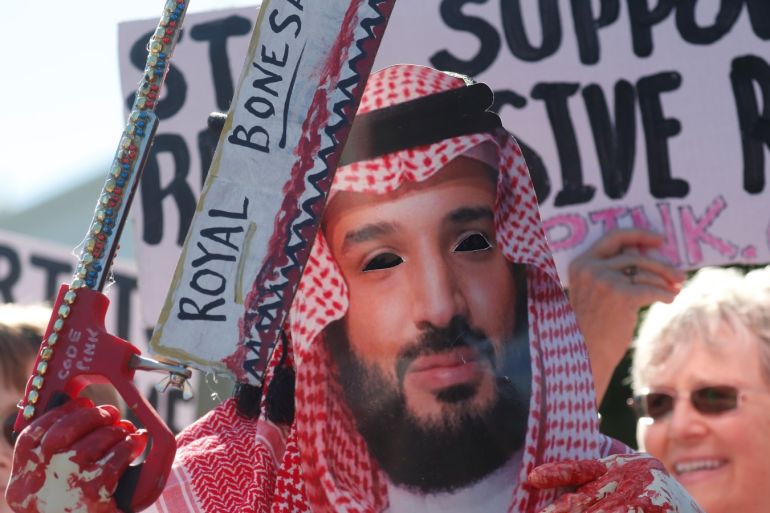 An activist dressed as Saudi Crown Prince Mohammad bin Salman holds a prop bonesaw during a demonstration calling for sanctions against Saudi Arabia and to protest the disappearance of Saudi journalist Jamal Khashoggi, outside the White House in Washington, U.S., October 19, 2018. REUTERS/Leah Millis