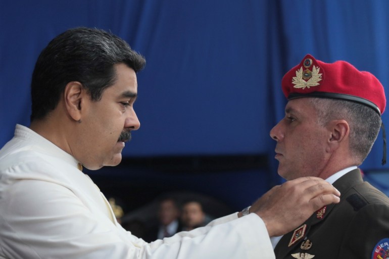 Venezuela's President Nicolas Maduro changes the epaulette of a Venezuela's army officer during a promotion ceremony in Caracas, Venezuela July 7, 2018. Miraflores Palace/Handout via REUTERS ATTENTION EDITORS - THIS PICTURE WAS PROVIDED BY A THIRD PARTY
