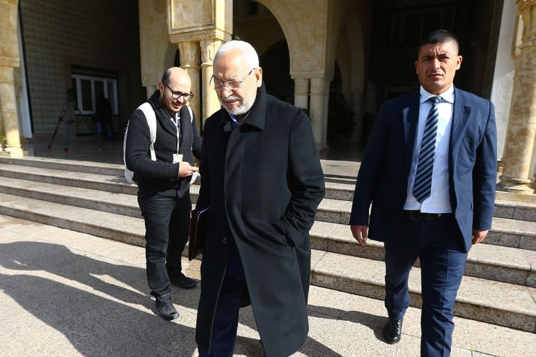 Unrest triggered by austerity measures in Tunisia- - TUNIS, TUNISIA - JANUARY 13: Leader of the En-Nahda Movement Rached Ghannouchi (C) leaves after a meeting with political parties, unions and employers on January 13, 2018 in Tunis, Tunisia following unrest triggered by austerity measures.