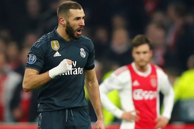 Soccer Football - Champions League Round of 16 First Leg - Ajax Amsterdam v Real Madrid - Johan Cruijff Arena, Amsterdam, Netherlands - February 13, 2019 Real Madrid's Karim Benzema celebrates scoring their first goal REUTERS/Wolfgang Rattay