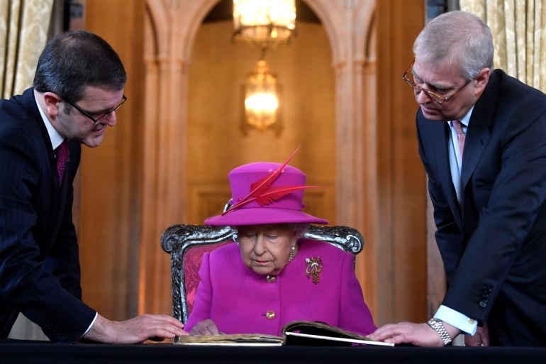 Britain's Queen Elizabeth, accompanied by Prince Andrew, visits The Honourable Society of Lincoln’s Inn to open the new Ashworth Centre, and re-open the recently renovated Great Hall, in London, Britain, December 13, 2018. REUTERS/Toby Melville