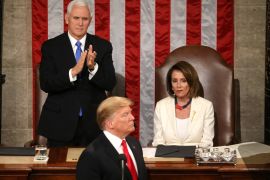 Speaker of the House Nancy Pelosi (D-CA) reacts alongside Vice President Mike Pence as he applauds U.S. President Donald Trump during his second State of the Union address to a joint session of the U.S. Congress in the House Chamber of the U.S. Capitol on Capitol Hill in Washington, U.S. February 5, 2019. REUTERS/Leah Millis - HP1EF260BXBAC TPX IMAGES OF THE DAY