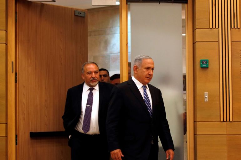 Israeli prime minister Benjamin Netanyahu (R) enters to a media conference together with Israel's new Defence Minister Avigdor Lieberman, head of far-right Yisrael Beitenu party, following Lieberman's swearing-in ceremony at the Knesset, the Israeli parliament, in Jerusalem May 30, 2016. REUTERS/Ronen Zvulun