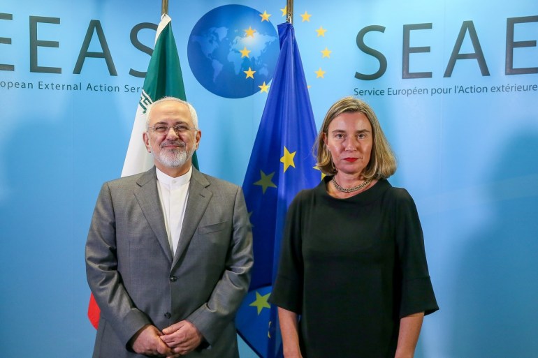 Iran's Foreign Minister Mohammad Javad Zarif is welcomed by European Union Foreign Policy Chief Federica Mogherini ahead of a meeting in Brussels, Belgium, April 25, 2018. Stephanie Lecocq/Pool via REUTERS