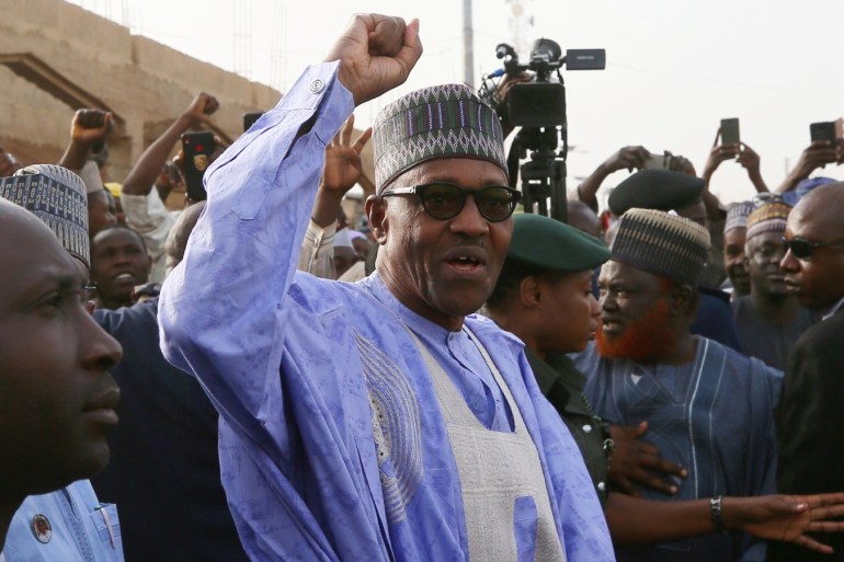 Nigerian President Muhammadu Buhari gestures as he arrives to cast a vote in Nigeria's presidential election at a polling station in Daura, Katsina State, Nigeria, February 23, 2019. REUTERS/Afolabi Sotunde