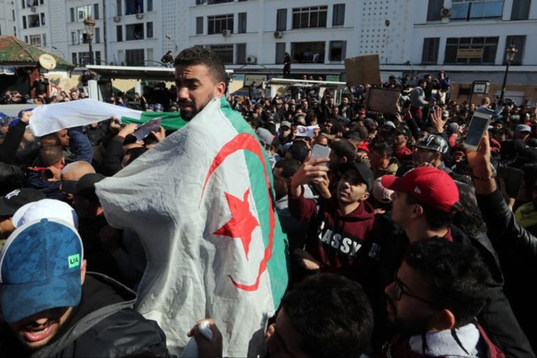 epa07388035 Algerian protesters chant slogans during a demonstration protest against the fifth term of Abdelaziz Bouteflika in Algiers, Algeria, 22 February 2019. Abdelaziz Bouteflik is president since 1999. The next presidential election in Algeria will take place on 18 April 2019. EPA-EFE/MOHAMED MESSARA