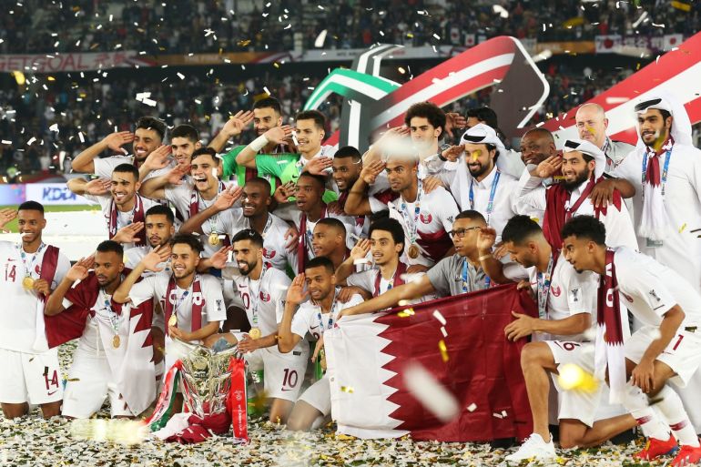 Japan v Qatar - AFC Asian Cup Final- - ABU DHABI, UAE - FEBRUARY 01: Qatar's players celebrate with the trophy after winning the 2019 AFC Asian Cup final match between Japan and Qatar in Abu Dhabi, United Arab Emirates, February 01, 2019.
