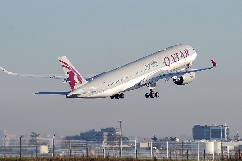 A Qatar Airways A350 takes off from the Airbus headquarters in Toulouse on December 22, 2014. Airbus delivered its first next-generation A350-900 plane to Qatar Airways in a formal ceremony that kickstarts its bid to erode rival Boeing's dominance in the lucrative long-haul market. AFP PHOTO / REMY GABALDA