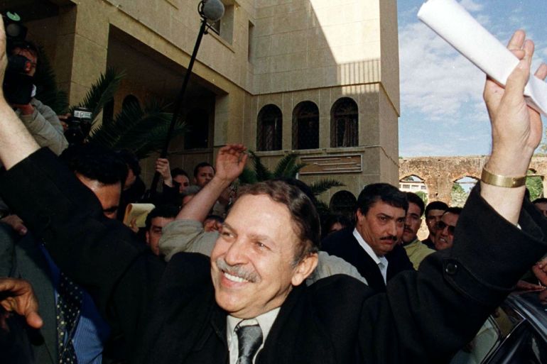 Newly-elected Algerian President Abdelaziz Bouteflika raises his arms as he celebrates a day after the nation went to the polls, April 16. [Elsewhere in the capital, street protests broke out after army favourite Bouteflika was declared the winner of a one-candidate election boycotted by the opposition after six hopefuls had withdrawn before Thursday's election in protest at what they called vote-rigging.]