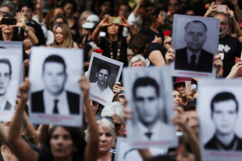 Demonstrators hold placards with pictures of the victims of the military dictatorship at a protest against the 55th anniversary of Brazil's 1964 military coup in Sao Paulo, Brazil, March 31, 2019. REUTERS/Amanda Perobelli TPX IMAGES OF THE DAY