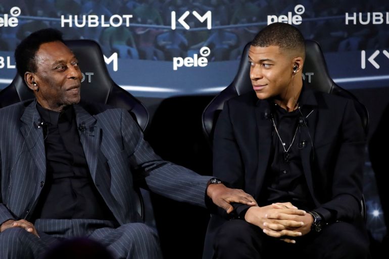 French soccer player Kylian Mbappe and Brazilian soccer legend Pele pose ahead of their meeting in Paris, France April 2, 2019. REUTERS/Christian Hartmann