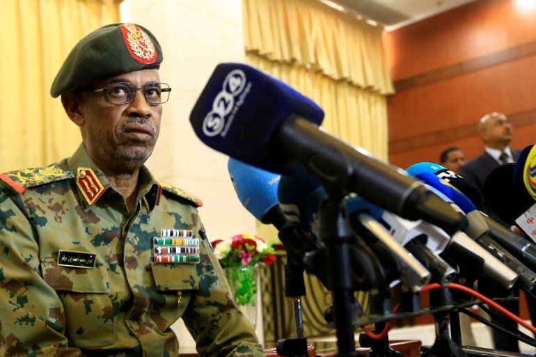 Defence Minister Awad Mohamed Ahmed Ibn Auf, an ex-military intelligence chief talks to the media after being sworn in as first vice president during a swearing in ceremony of new officials after Sudan's President Omar al-Bashir dissolved the central and state governments in Khartoum, Sudan February 24, 2019. REUTERS/Mohamed Nureldin Abdallah