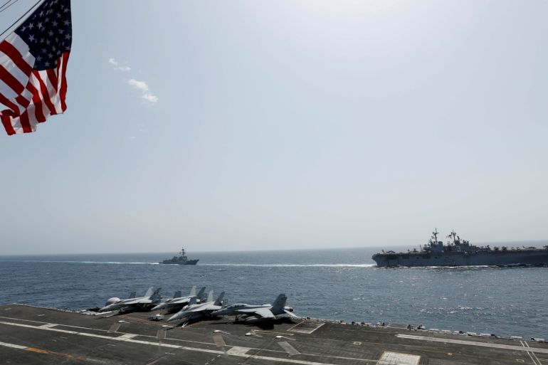 The U.S. Navy Wasp-class amphibious assault ship USS Kearsarge and the Arleigh Burke-class guided-missile destroyer USS Bainbridge sail alongside the Nimitz-class aircraft carrier USS Abraham Lincoln in the Arabian Sea May 17, 2019. Picture taken May 17, 2019. US Navy/Mass Communication Specialist Seaman Michael Singley/Handout via REUTERS. ATTENTION EDITORS - THIS IMAGE WAS PROVIDED BY A THIRD PARTY.