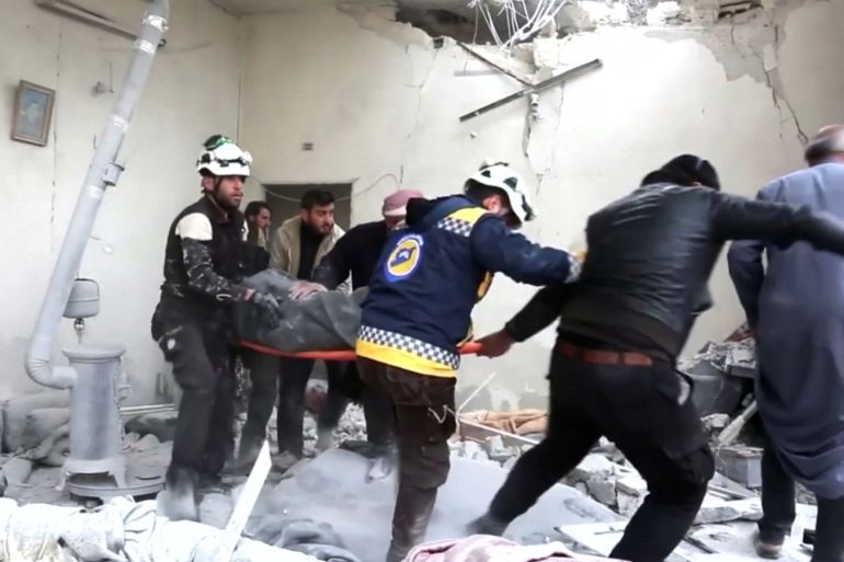 Civil defence forces carry an injured person on stretcher through rubble, after an air strike on location targeted by government forces, in Khan Sheikhoun, Idlib, Syria February 26, 2019, in this still image taken from video. ReutersTV/via REUTERS ATTENTION EDITORS - THIS IMAGE WAS PROVIDED BY A THIRD PARTY. IT WAS PROCESSED BY REUTERS TO ENHANCE QUALITY. NO RESALES. NO ARCHIVES.