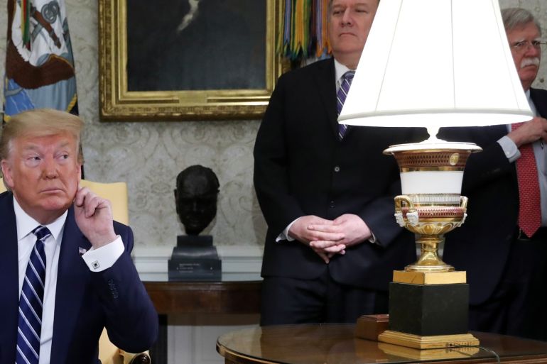 U.S. President Donald Trump listens to questions during a meeting with Canada's Prime Minister Justin Trudeau as Secretary of State Mike Pompeo and White House national security adviser John Bolton look on in the Oval Office of the White House in Washington, U.S., June 20, 2019. REUTERS/Jonathan Ernst