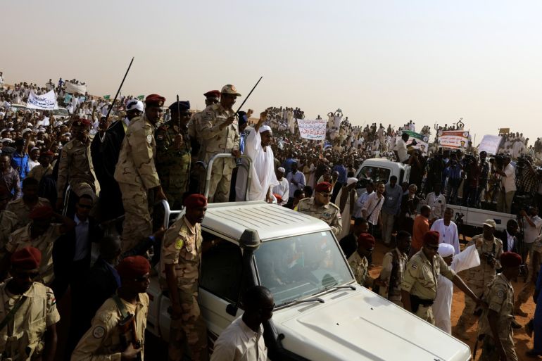 Lieutenant General Mohamed Hamdan Dagalo, deputy head of the military council and head of paramilitary Rapid Support Forces (RSF), greets his supporters as he arrives at a meeting in Aprag village, 60 kilometers away from Khartoum, Sudan, June 22, 2019. REUTERS/Umit Bektas