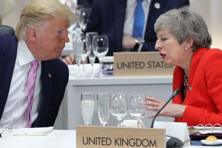Britain's Prime Minister Theresa May speaks with U.S. President Donald Trump during the G20 summit in Osaka, Japan June 28, 2019. Sputnik/Mikhail Klimentyev/Kremlin via REUTERS ATTENTION EDITORS - THIS IMAGE WAS PROVIDED BY A THIRD PARTY.