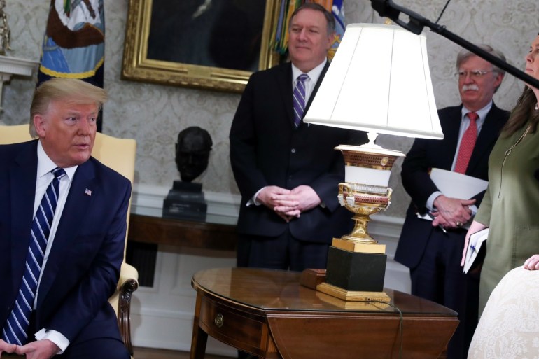 U.S. President Donald Trump speaks during a meeting with Canada's Prime Minister Justin Trudeau as Secretary of State Mike Pompeo, White House national security adviser John Bolton and Press Secretary Sarah Sanders look on in the Oval Office of the White House in Washington, U.S., June 20, 2019. REUTERS/Jonathan Ernst