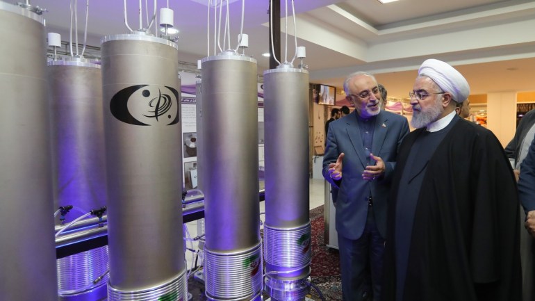 Iranian President Hassan Rouhani (R) and the head of Iran nuclear technology organization
